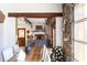 Rustic dining room with stone wall and view of the pool at 1605 Brandon Hall Dr, Atlanta, GA 30350