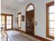 Bright entryway with hardwood floors, arched entry door, and multiple windows at 1605 Brandon Hall Dr, Atlanta, GA 30350