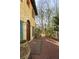 Welcoming front entrance with arched entryway, brick walkway and terracotta pots at 1605 Brandon Hall Dr, Atlanta, GA 30350