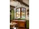 Rustic kitchen features a farmhouse sink, wood cabinetry, and an inviting window at 1605 Brandon Hall Dr, Atlanta, GA 30350