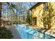 Long lap pool with a patio and a yellow house in the background at 1605 Brandon Hall Dr, Atlanta, GA 30350