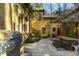 Outdoor kitchen and dining area with a built-in grill and seating at 1605 Brandon Hall Dr, Atlanta, GA 30350