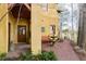 Side entrance with fountain, stone pathway, and wooden bench at 1605 Brandon Hall Dr, Atlanta, GA 30350