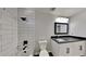 Modern bathroom with subway tile and dark vanity at 2548 Bellview Nw Ave, Atlanta, GA 30318