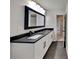 Updated bathroom, featuring a long vanity with dark countertop at 2548 Bellview Nw Ave, Atlanta, GA 30318