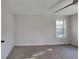 Well-lit bedroom, featuring carpet and large window at 2548 Bellview Nw Ave, Atlanta, GA 30318