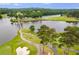 Aerial view of golf course with lake and bridge at 5008 Cambridge Ln, Villa Rica, GA 30180