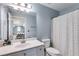 Small bathroom with a shower/tub combo and white vanity at 5008 Cambridge Ln, Villa Rica, GA 30180