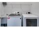 Bright laundry room with side-by-side washer and dryer at 5008 Cambridge Ln, Villa Rica, GA 30180