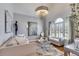 Elegant living room with hardwood floors, neutral colors and large windows at 5008 Cambridge Ln, Villa Rica, GA 30180