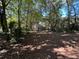 Partially wooded backyard with storage shed at 1090 Forest Ave, Stone Mountain, GA 30083