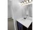 Bathroom vanity with a white countertop and dark brown cabinet at 2190 Wellington Cir, Lithonia, GA 30058
