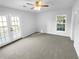 Spacious bedroom with carpeting, ceiling fan, and access to a private deck at 2190 Wellington Cir, Lithonia, GA 30058