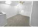 Bonus room with carpet, ceiling fan and large closet at 2190 Wellington Cir, Lithonia, GA 30058