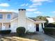 Cute yellow house with a black door and small front yard at 2190 Wellington Cir, Lithonia, GA 30058