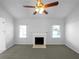 Living room with fireplace, ceiling fan and neutral decor at 2190 Wellington Cir, Lithonia, GA 30058