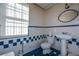 Small bathroom with pedestal sink, toilet, and shower at 750 Skipper Dr, Atlanta, GA 30318