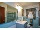 Bathroom with blue tiled walls and a shower/tub combo at 750 Skipper Dr, Atlanta, GA 30318