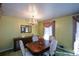 Formal dining room with a dark wood table and chandelier, offering a sophisticated ambiance at 750 Skipper Dr, Atlanta, GA 30318