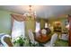 Bright dining room featuring a formal dining setting and views into the living room at 750 Skipper Dr, Atlanta, GA 30318
