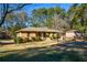 Brick ranch house with a landscaped lawn at 750 Skipper Dr, Atlanta, GA 30318