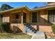 Brick front porch with steps and wrought iron railing at 750 Skipper Dr, Atlanta, GA 30318