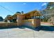 Attached garage with a large door and covered patio above at 750 Skipper Dr, Atlanta, GA 30318