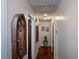 Long hallway with wood floors and wall art at 750 Skipper Dr, Atlanta, GA 30318