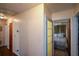 Home hallway with wood floors and access to bedrooms at 750 Skipper Dr, Atlanta, GA 30318