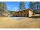 Brick house exterior with large backyard and mature trees at 750 Skipper Dr, Atlanta, GA 30318