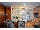 Cozy kitchen with a brick fireplace, white cabinets, and a convenient breakfast bar at 750 Skipper Dr, Atlanta, GA 30318