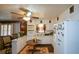 Galley-style kitchen with white cabinets, tile flooring, and a breakfast bar at 750 Skipper Dr, Atlanta, GA 30318