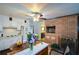 Functional kitchen with white cabinetry, tile flooring, and a brick fireplace at 750 Skipper Dr, Atlanta, GA 30318