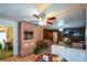 Open concept kitchen and living area with brick fireplace and tile floors at 750 Skipper Dr, Atlanta, GA 30318