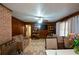 Living room features tile floors and wood paneled walls at 750 Skipper Dr, Atlanta, GA 30318