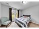 Cozy bedroom with natural light, comfortable chair, and scenic outdoor views at 2205 Castle Royale Dr, Lawrenceville, GA 30043