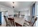 An open-concept dining area flows into the living space, enhancing natural light and connectivity at 2205 Castle Royale Dr, Lawrenceville, GA 30043