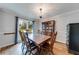 Traditional dining room features hardwood floors, elegant chandelier, and classic wood furniture at 2205 Castle Royale Dr, Lawrenceville, GA 30043