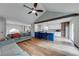 Bright living room with an open floor plan, featuring a kitchen island and hardwood floors at 2205 Castle Royale Dr, Lawrenceville, GA 30043