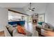 Inviting living room featuring a cozy fireplace, hardwood floors, and an open-concept kitchen at 2205 Castle Royale Dr, Lawrenceville, GA 30043