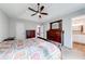 Main bedroom boasts tray ceilings, ceiling fan, and ensuite bathroom, offering comfort and privacy at 2205 Castle Royale Dr, Lawrenceville, GA 30043