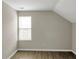 Bedroom with sloped ceiling and wood floors at 1177 Arlington Ave, Atlanta, GA 30310