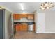 Kitchen with wood cabinets, stainless steel appliances and laminate flooring at 1177 Arlington Ave, Atlanta, GA 30310