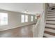 Living room with hardwood floors and white staircase at 1177 Arlington Ave, Atlanta, GA 30310