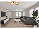 Spacious living room featuring a sectional sofa, coffee table, and large TV at 1177 Arlington Ave, Atlanta, GA 30310