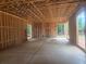 Spacious basement featuring concrete flooring and wood framing for future customization at 120 Cedarwood Ln, Roswell, GA 30075