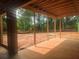 Covered patio overlooking a tranquil backyard, perfect for relaxation and outdoor entertainment at 120 Cedarwood Ln, Roswell, GA 30075