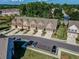 Aerial view of townhouses and street at 1216 Foxcroft Ln, Cumming, GA 30041