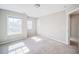 Spacious bedroom with carpet flooring and two windows at 1216 Foxcroft Ln, Cumming, GA 30041