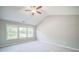 Large main bedroom with vaulted ceilings and carpeting at 1216 Foxcroft Ln, Cumming, GA 30041